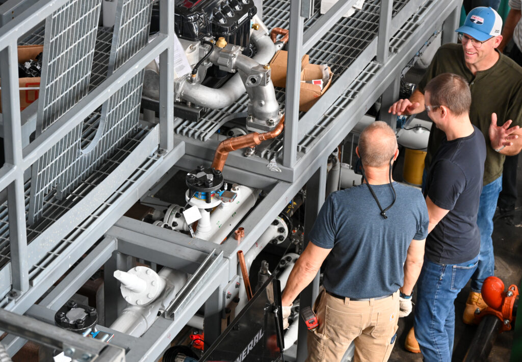 Three people in a lab at the Powerhouse