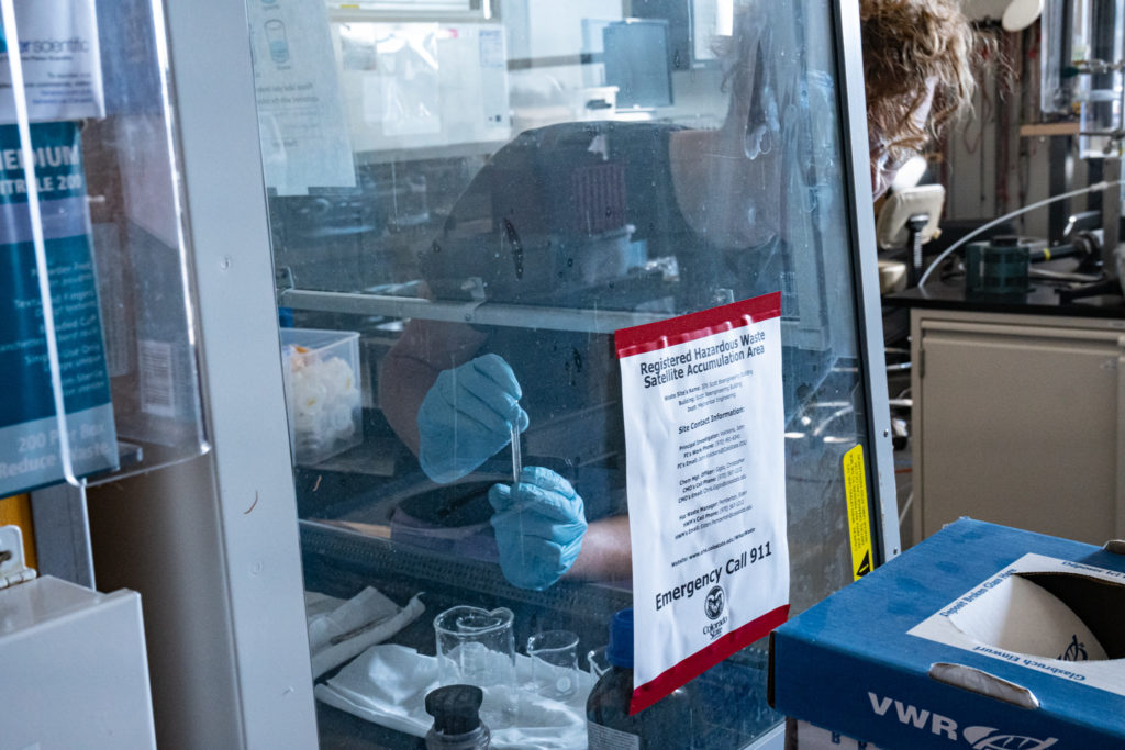 Jamie Cast uses lab equipment in the Powerhouse Energy Campus