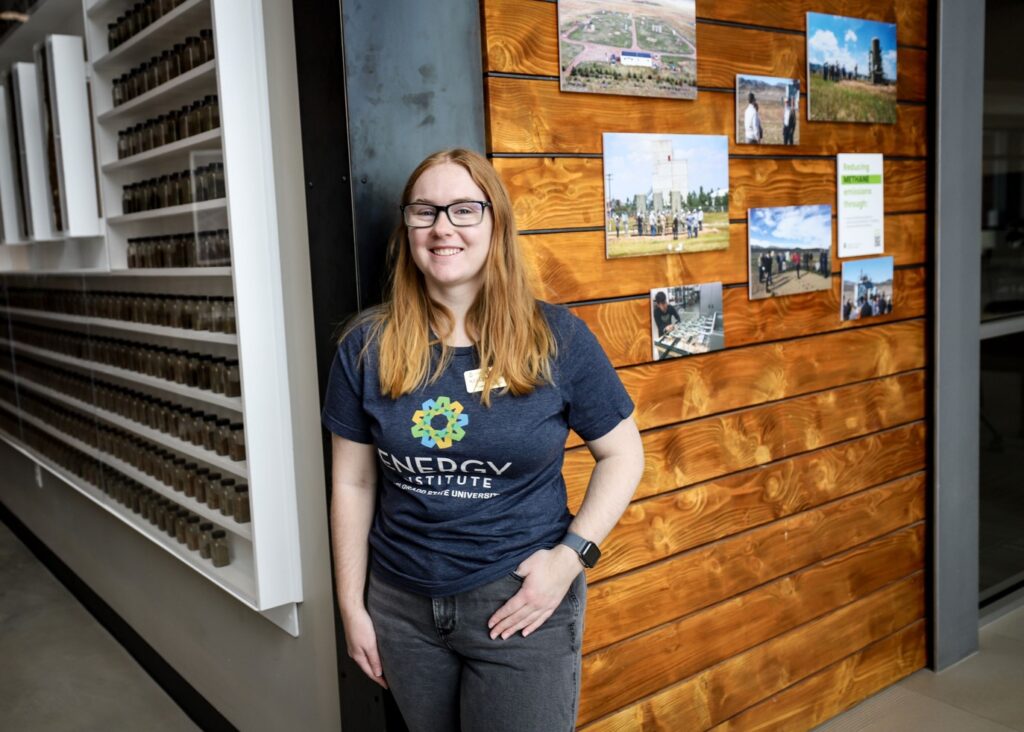 A tour ambassador poses for a photo in the lobby of the Powerhouse