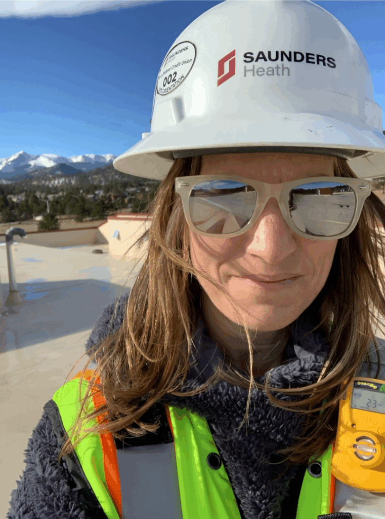 Karen wearing protective equipment on a construction site.