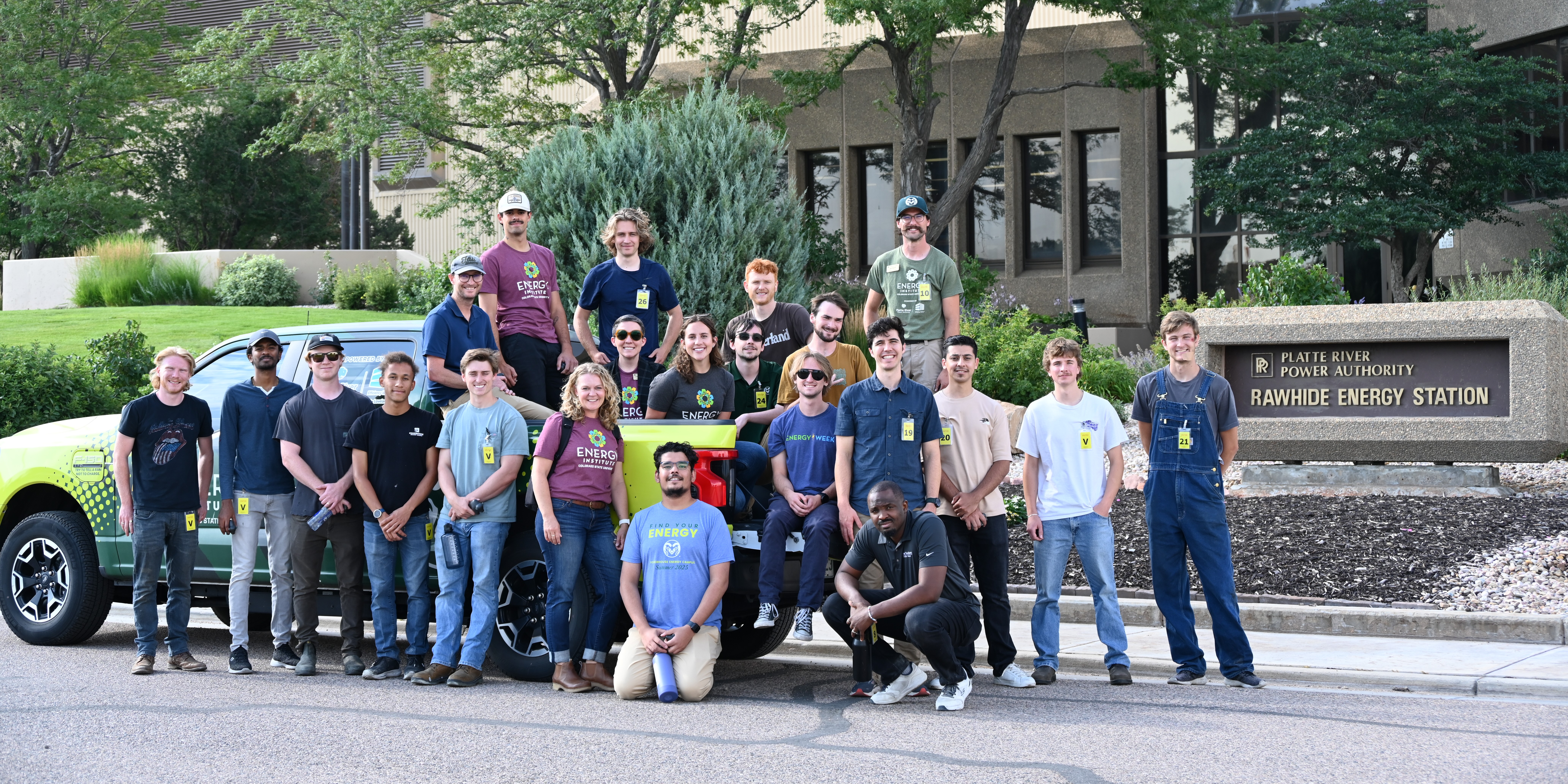A group of students pose by the Energy Institute Truck in front of the Rawhide Power Station
