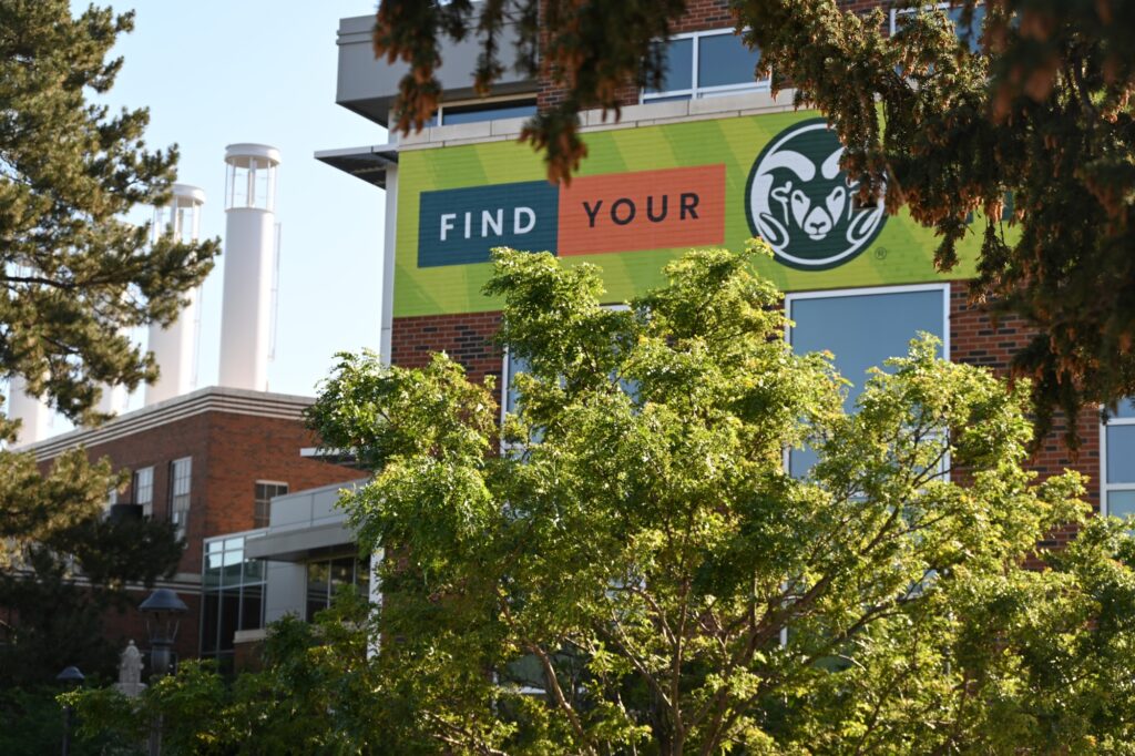 Powerhouse Energy Campus viewed through trees.