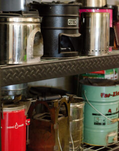 Envirofit stove prototypes on a shelf in the Powerhouse