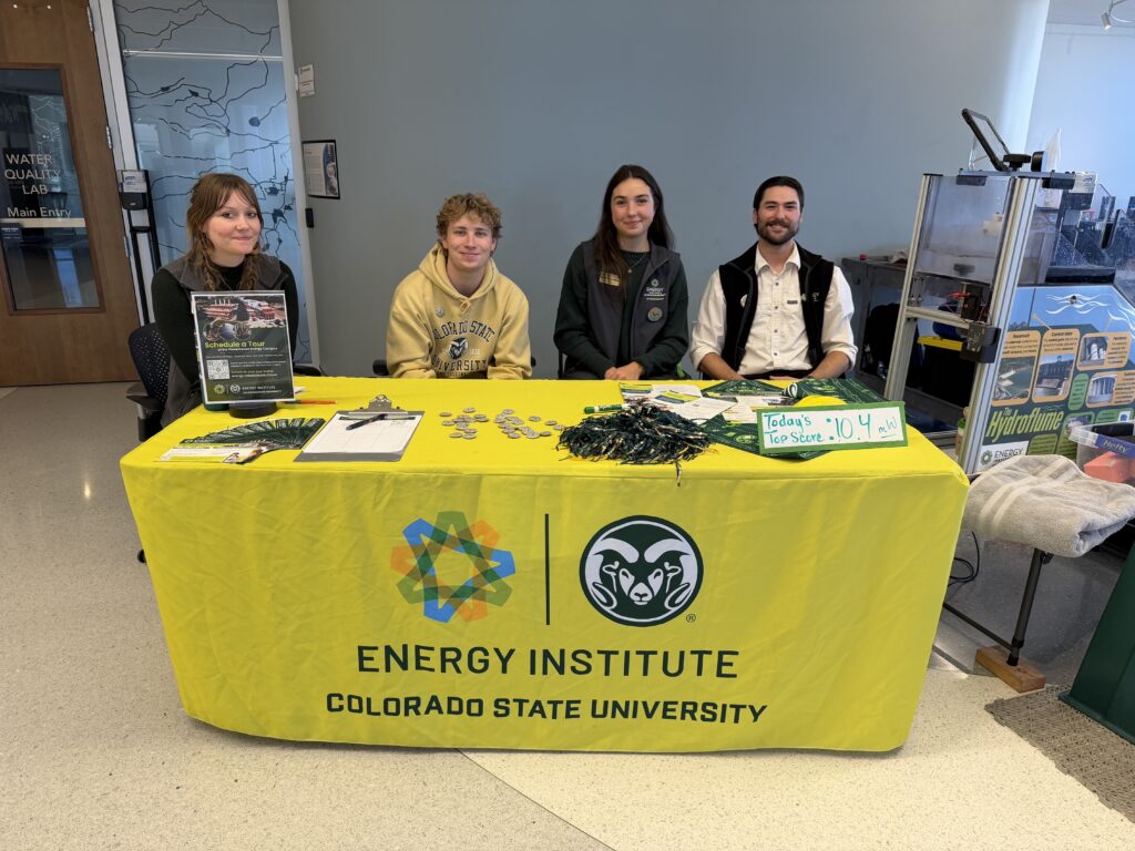 4 outreach team members at a table