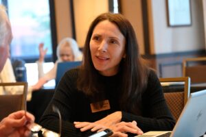 CNEE team member has a conversation at CELA