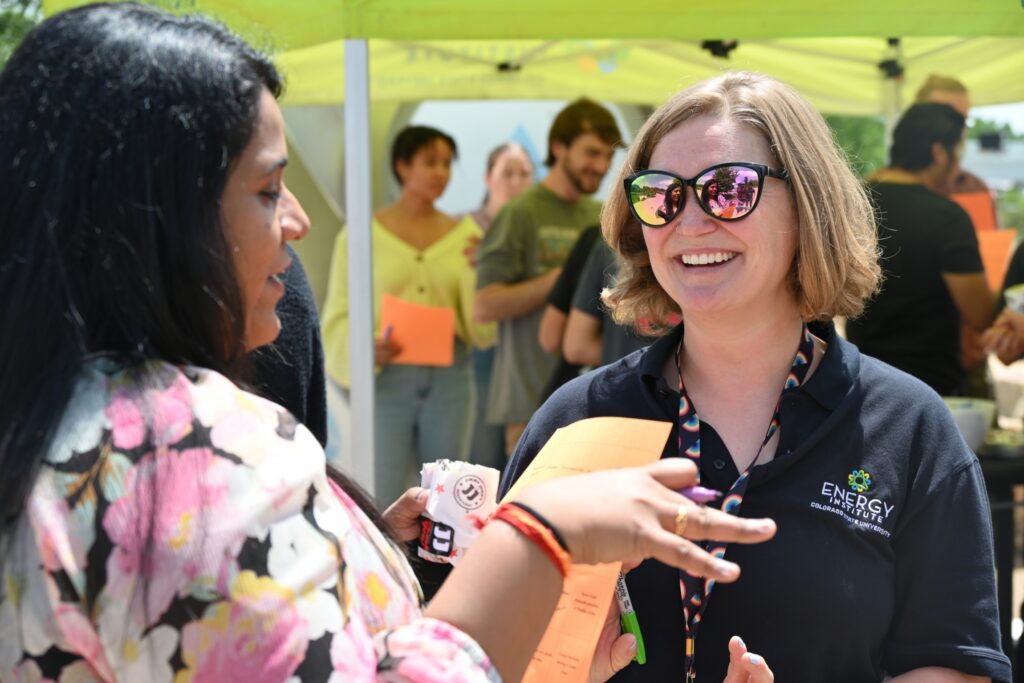 Two people have a conversation at a Powerhouse event