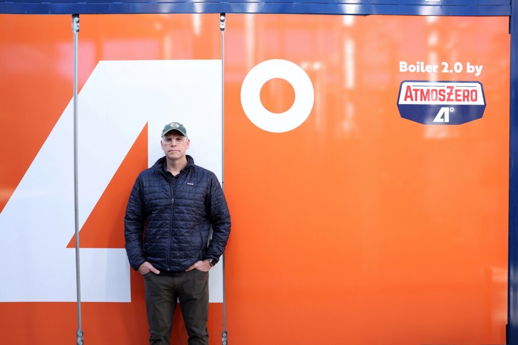 Todd stands in front of AtmosZero equipment