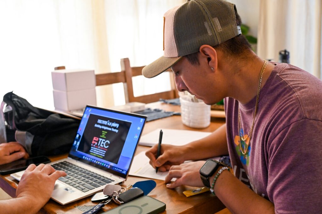 Researchers enter data onsite at a home